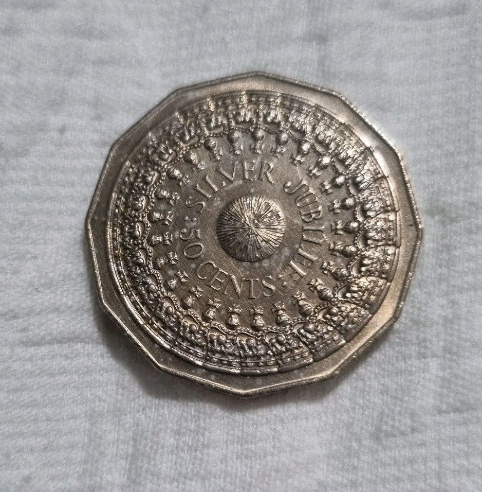 1977 Silver Jubilee 50 cent coin with heavy toning