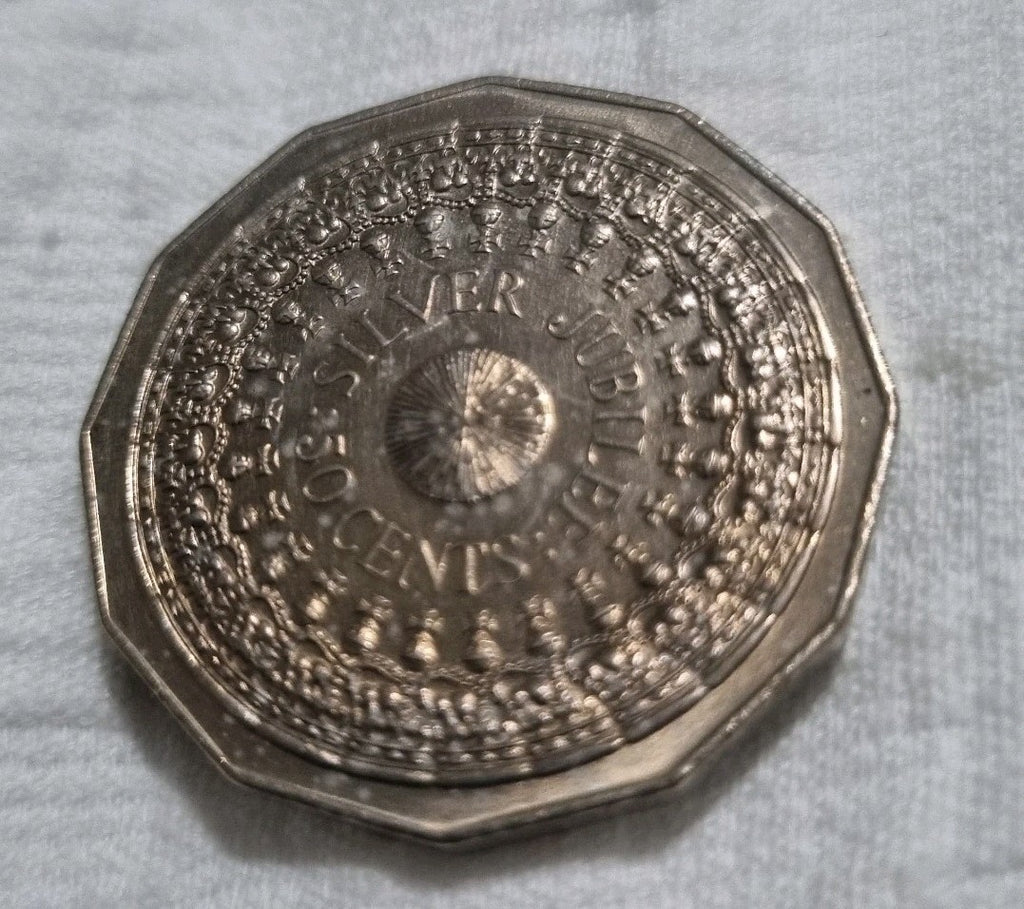 1977 Silver Jubilee 50 cent coin with heavy toning