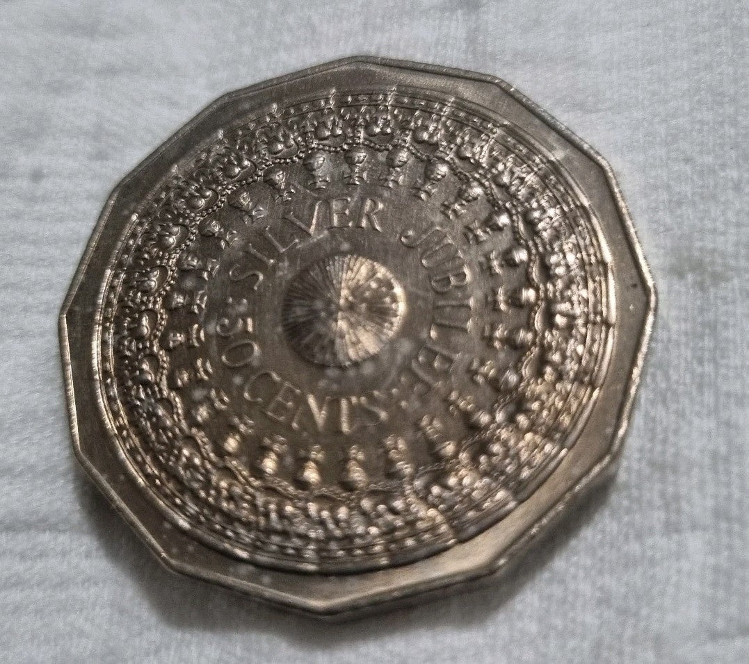 1977 Silver Jubilee 50 cent coin with heavy toning