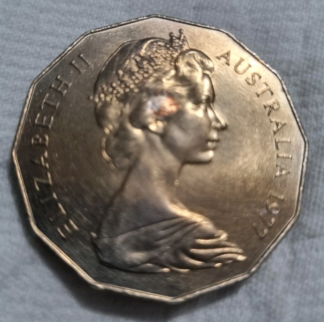 1977 Silver Jubilee 50 cent coin with heavy toning