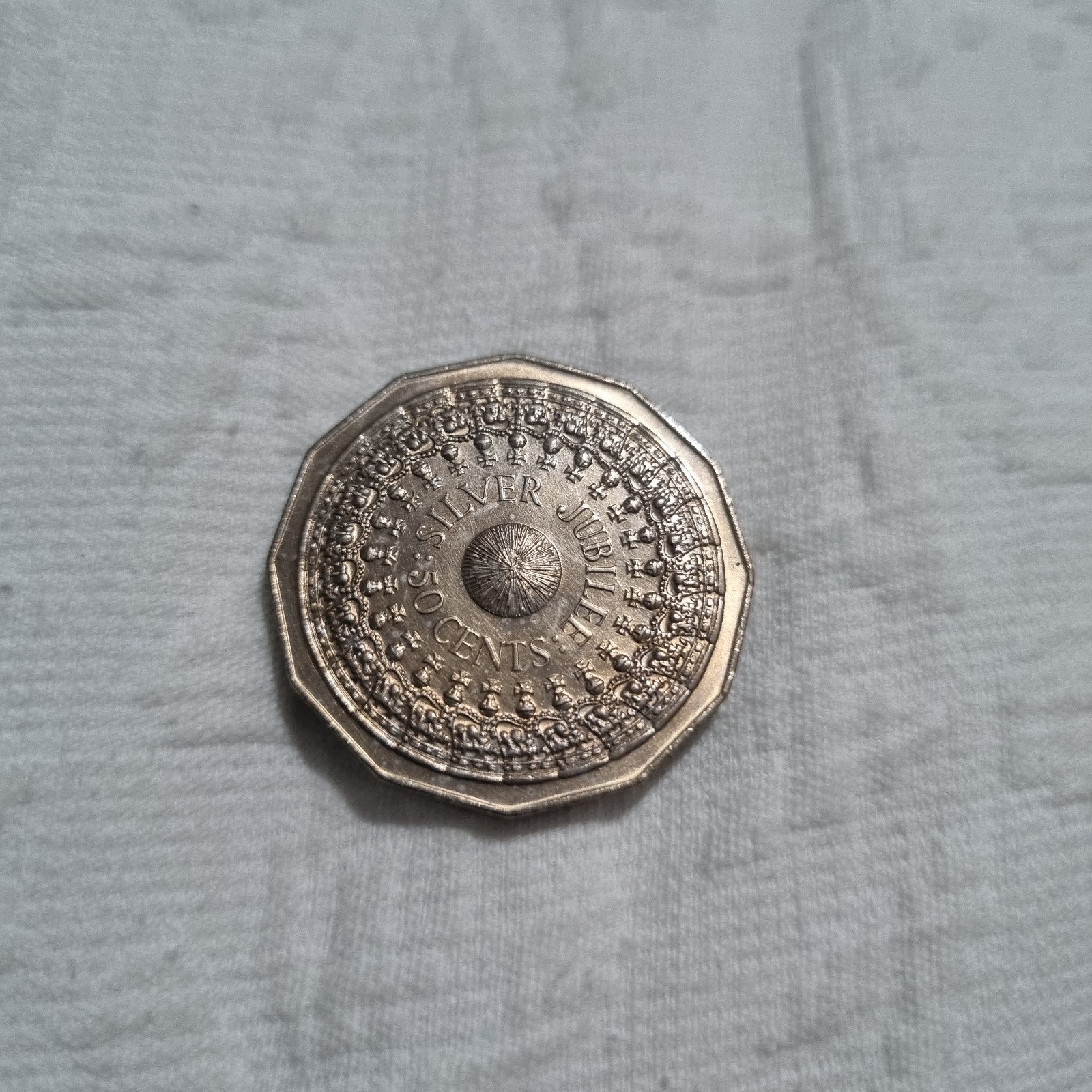 1977 Silver Jubilee 50 cent coin with heavy toning