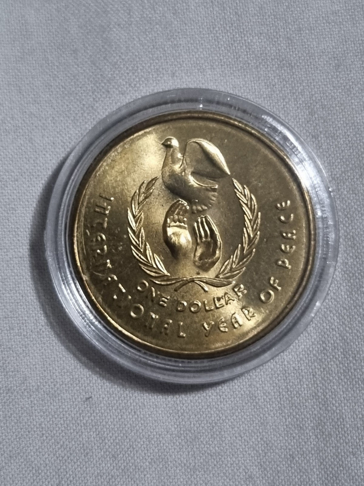 1986 UNC Australian 1 Dollar Year Of Peace Coin In Capsule from RAM Roll