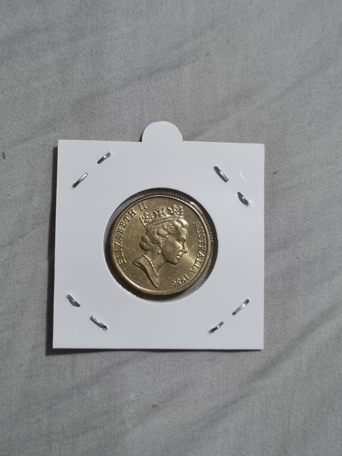 1986 UNC Australian 1 Dollar Year Of Peace Coin In 2x2 Holder from RAM Roll