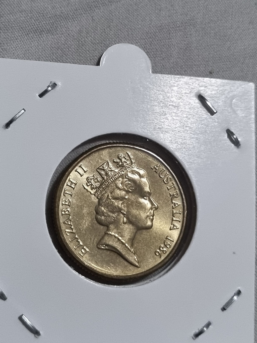 1986 UNC Australian 1 Dollar Year Of Peace Coin In 2x2 Holder from RAM Roll