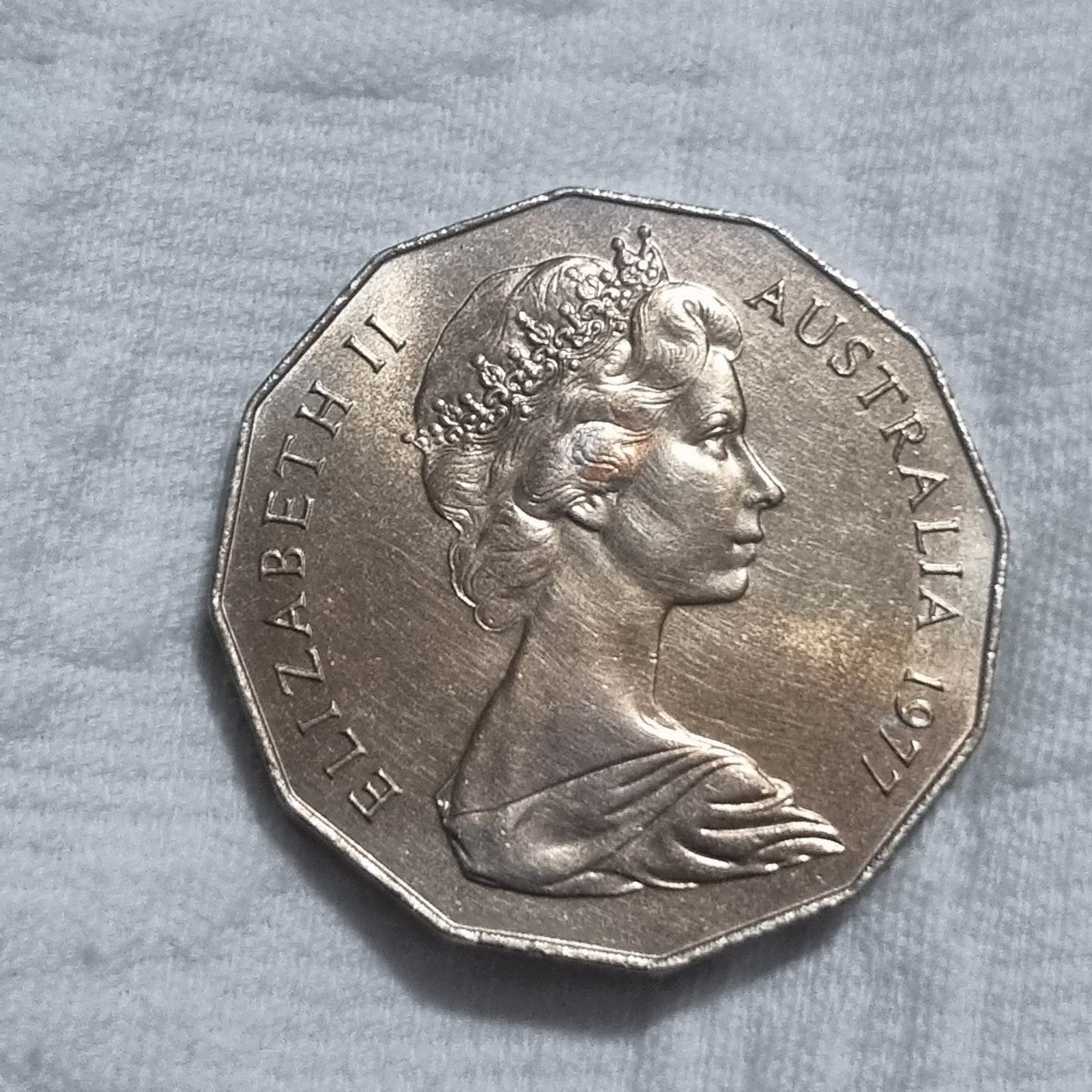 1977 Silver Jubilee 50 cent coin with heavy toning