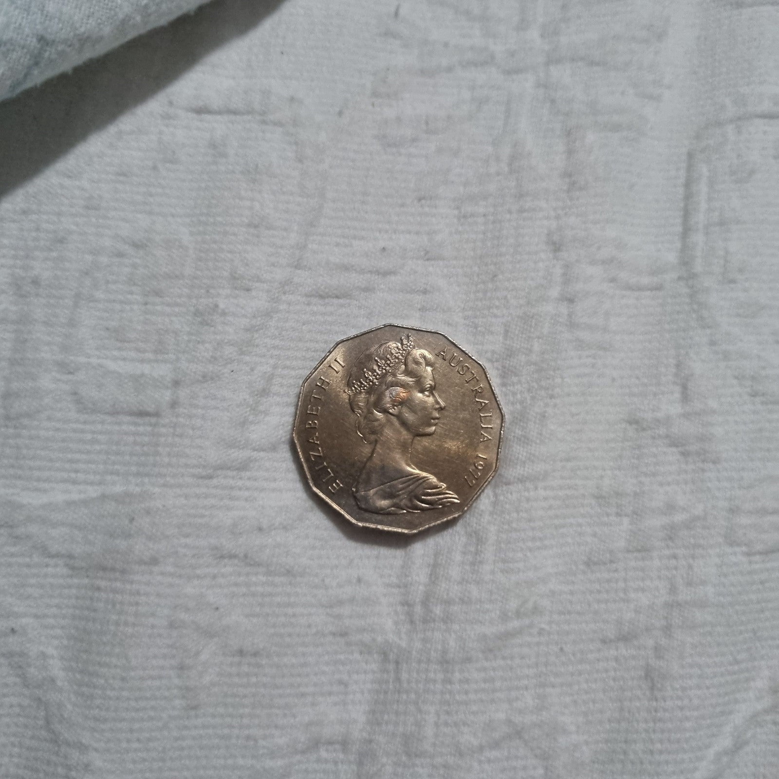 1977 Silver Jubilee 50 cent coin with heavy toning
