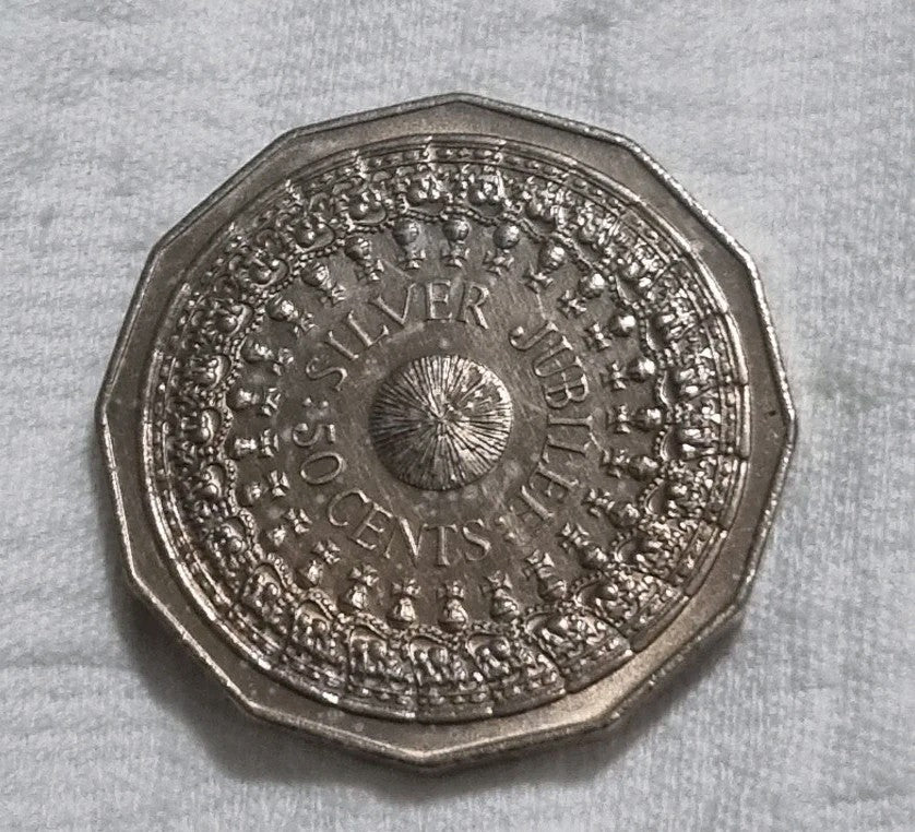 1977 Silver Jubilee 50 cent coin with heavy toning