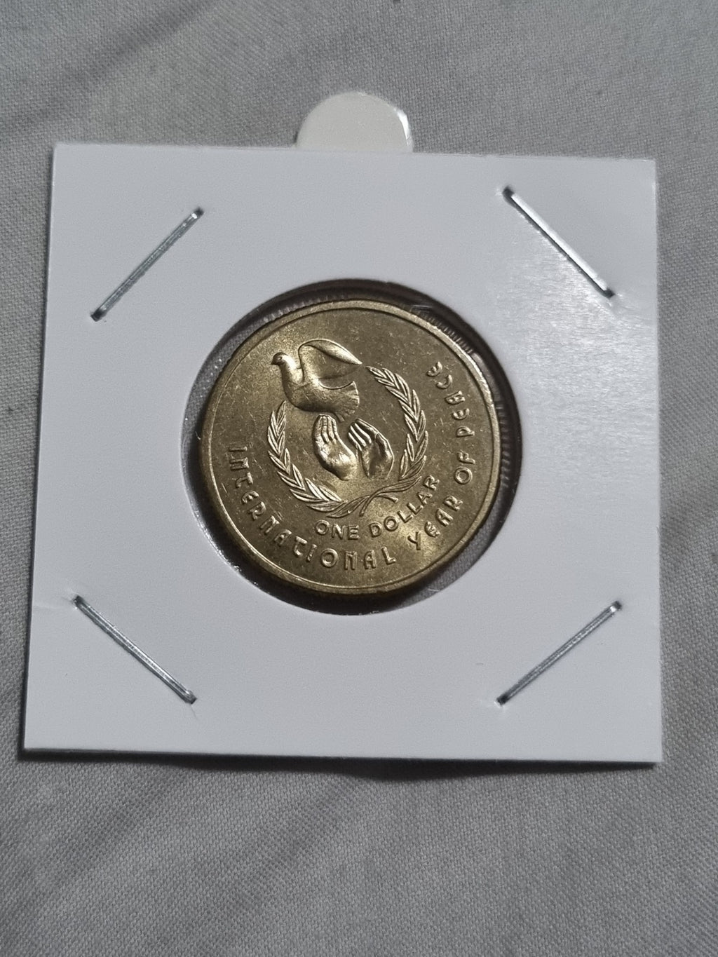 1986 UNC Australian 1 Dollar Year Of Peace Coin In 2x2 Holder from RAM Roll