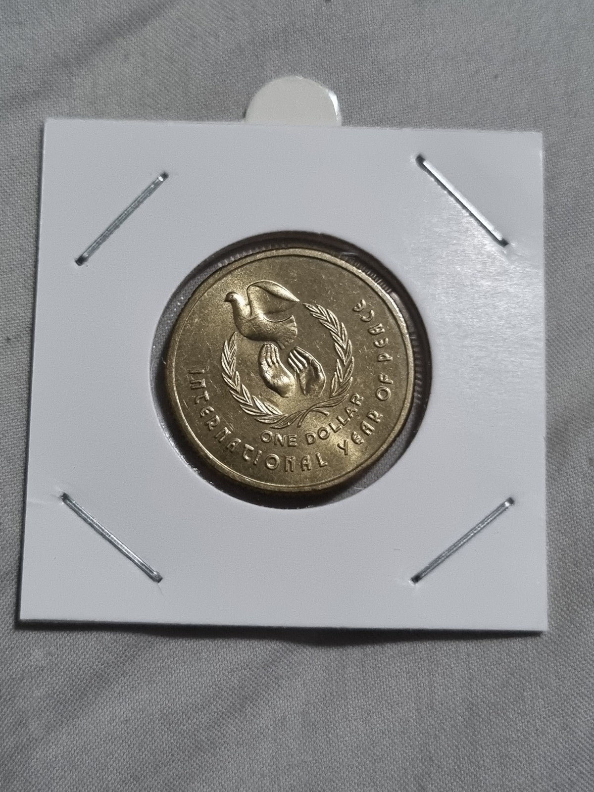 1986 UNC Australian 1 Dollar Year Of Peace Coin In 2x2 Holder from RAM Roll