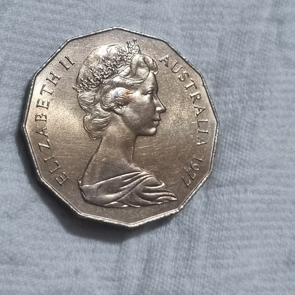 1977 Silver Jubilee 50 cent coin with heavy toning