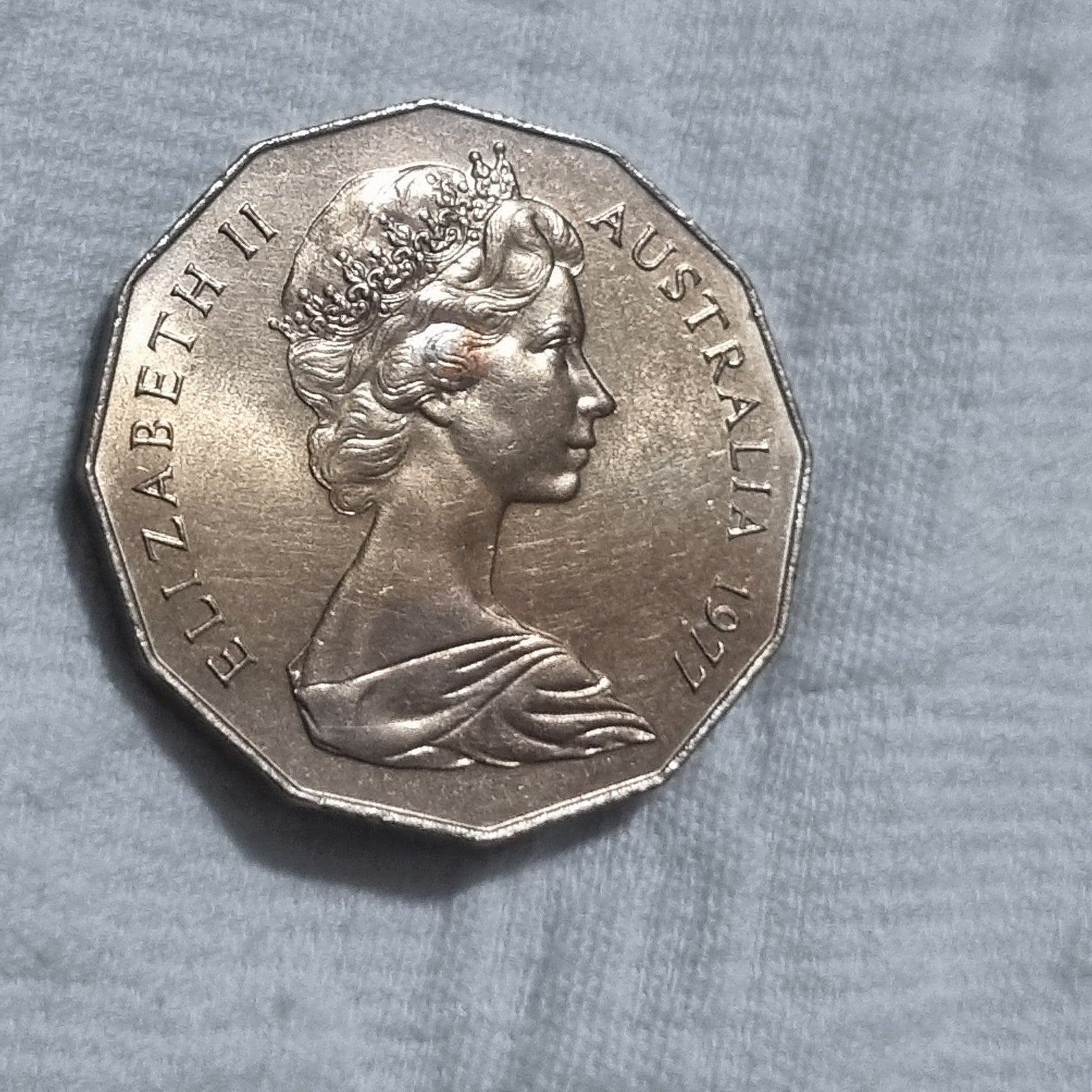 1977 Silver Jubilee 50 cent coin with heavy toning