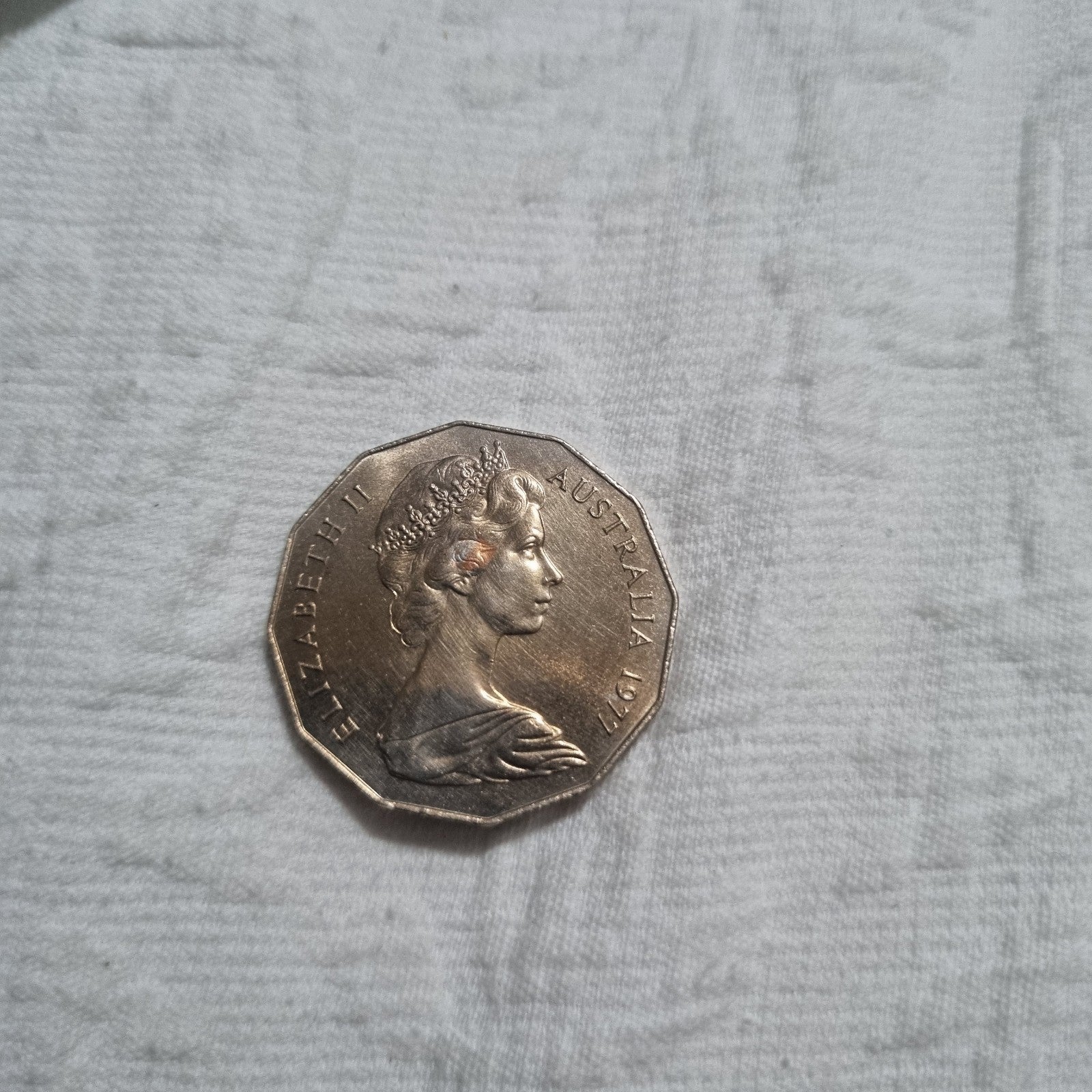 1977 Silver Jubilee 50 cent coin with heavy toning