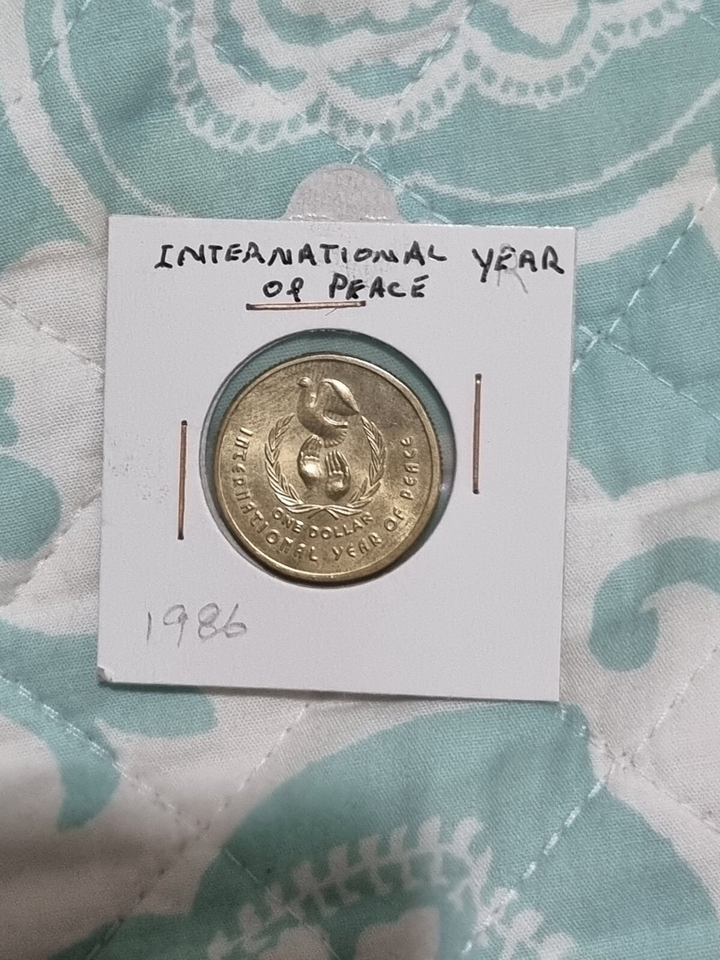 1986 UNC Australian 1 Dollar Year Of Peace Coin In 2x2 from RAM Roll