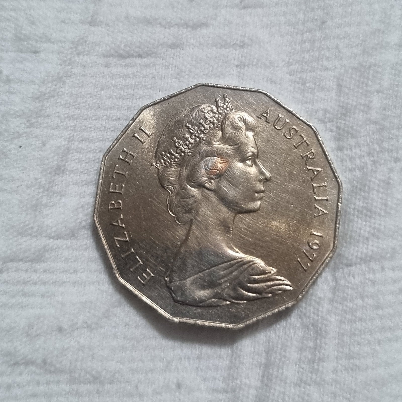 1977 Silver Jubilee 50 cent coin with heavy toning
