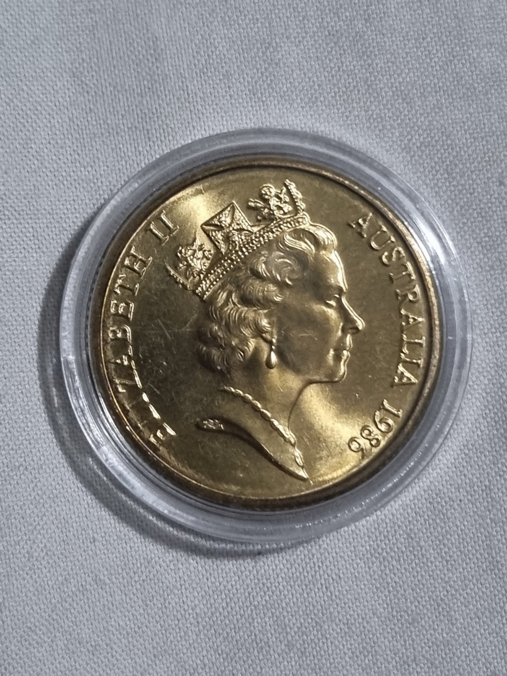 1986 UNC Australian 1 Dollar Year Of Peace Coin In Capsule from RAM Roll