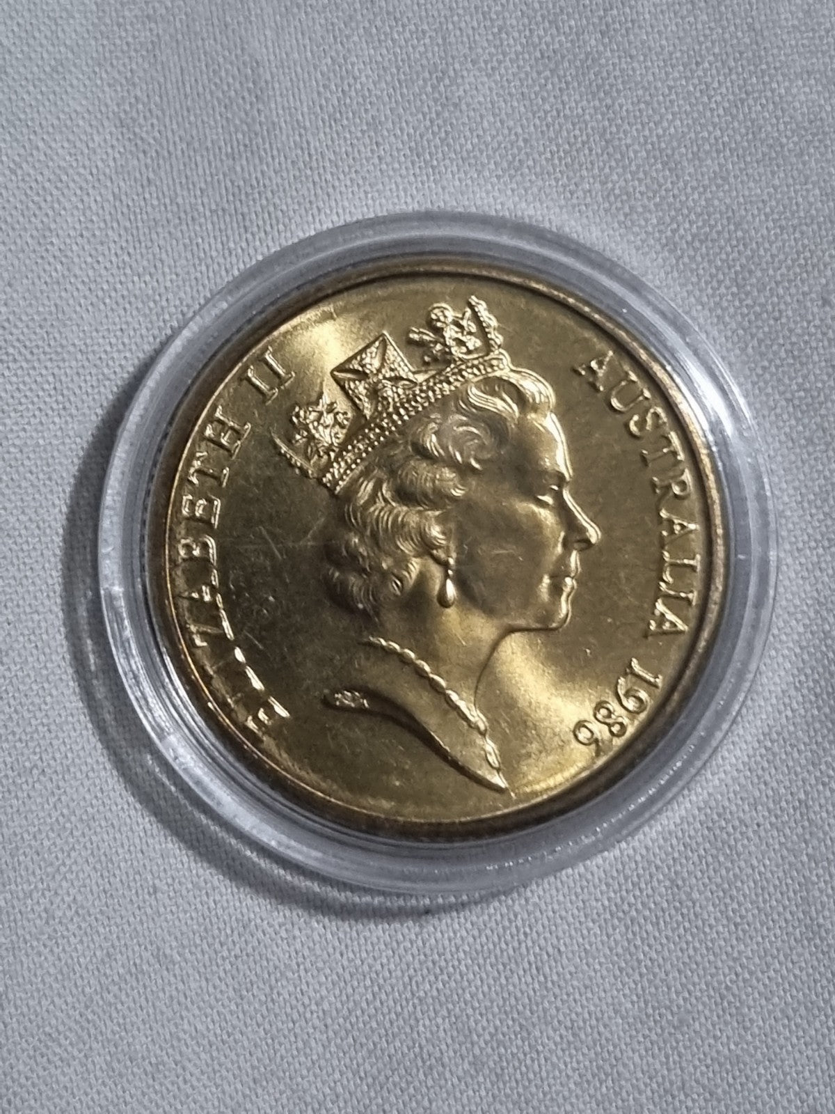 1986 UNC Australian 1 Dollar Year Of Peace Coin In Capsule from RAM Roll